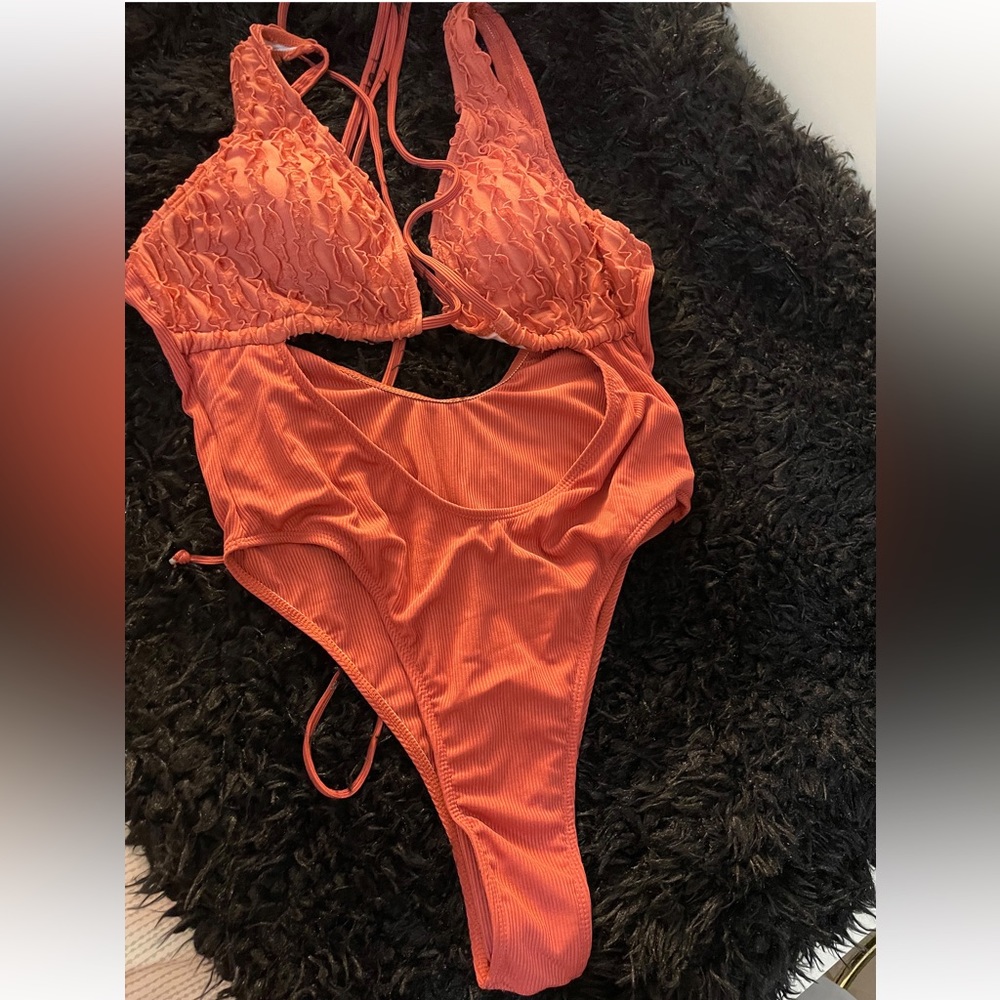 one-piece swimsuit features a plunging V-neck